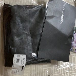 Brand new never used black leather-like skirt.